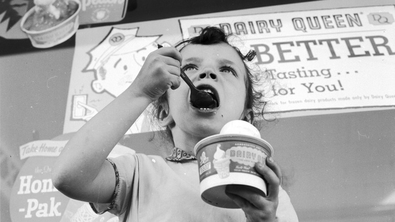 young girl eating Dairy Queen ice cream circa 1955