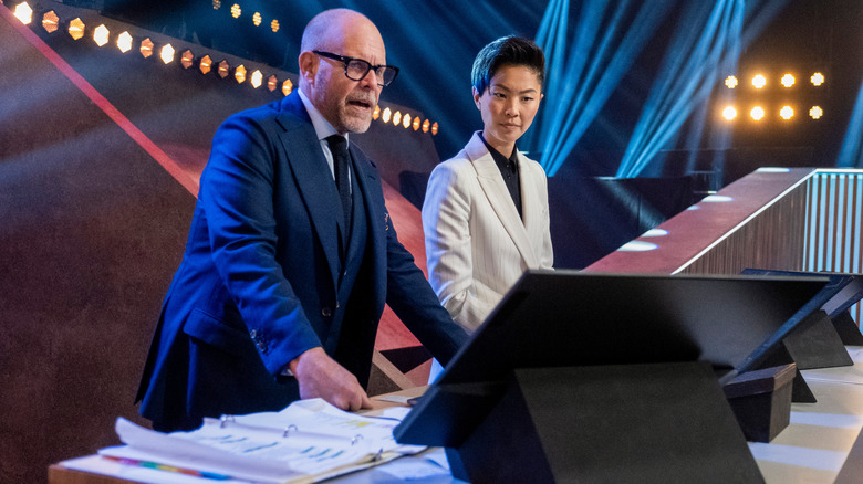 Iron Chef hosts Alton Brown and Kristen Kish