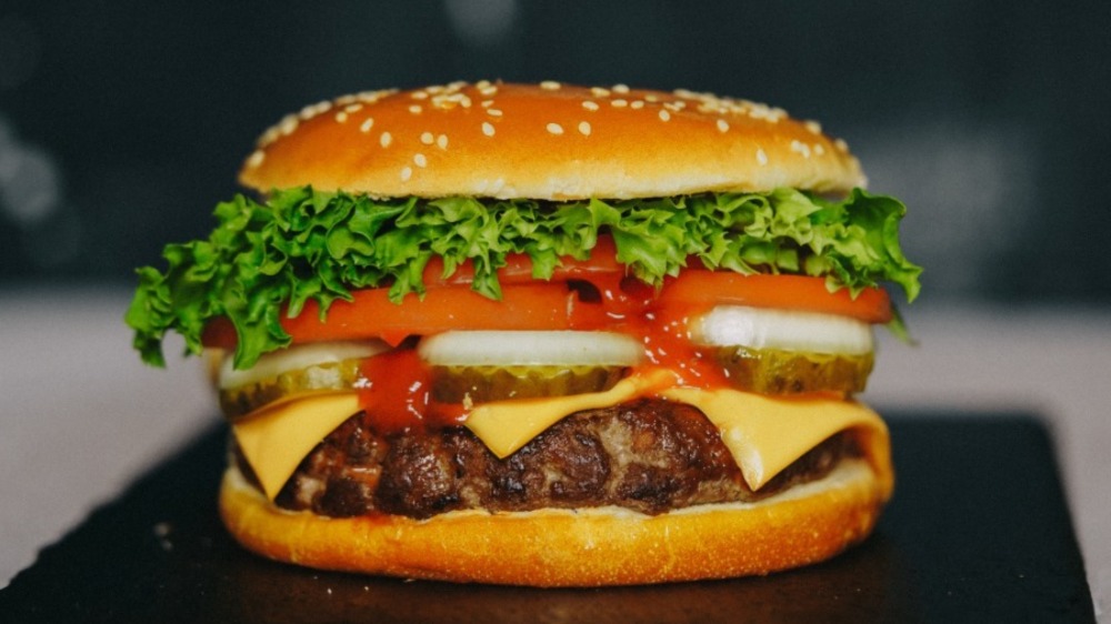 Closeup image of Whopper burger on toasted bun