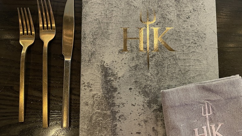 The menu and gold place settings at Hell's Kitchen in Las Vegas