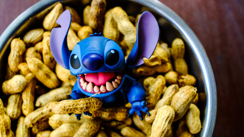 Disney's stitch character in a bowl of peanuts