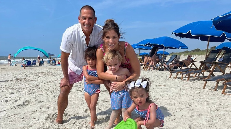 Bobby Deen, his wife Claudia, and their triplets on a beach