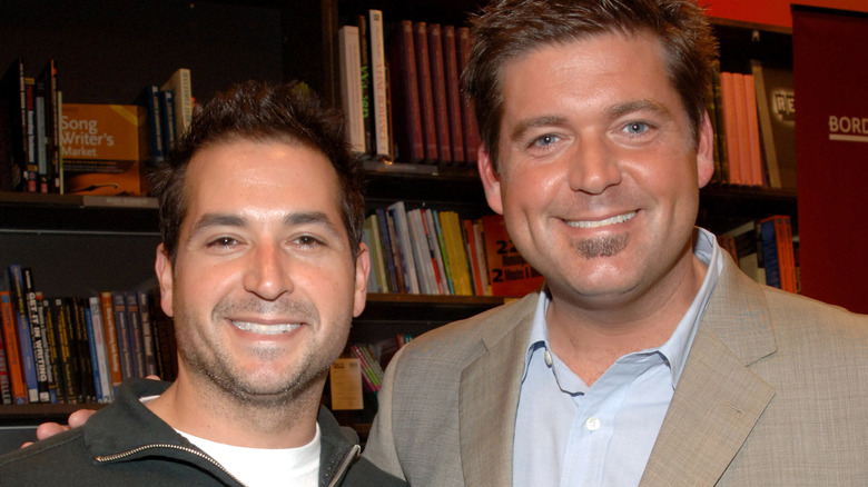 Bobby and Jamie Deen smiling with books in the background