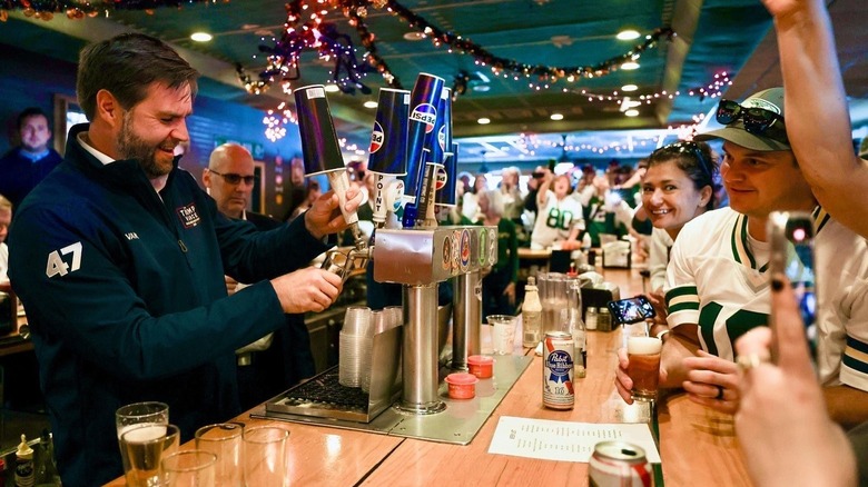 JD Vance pouring beer