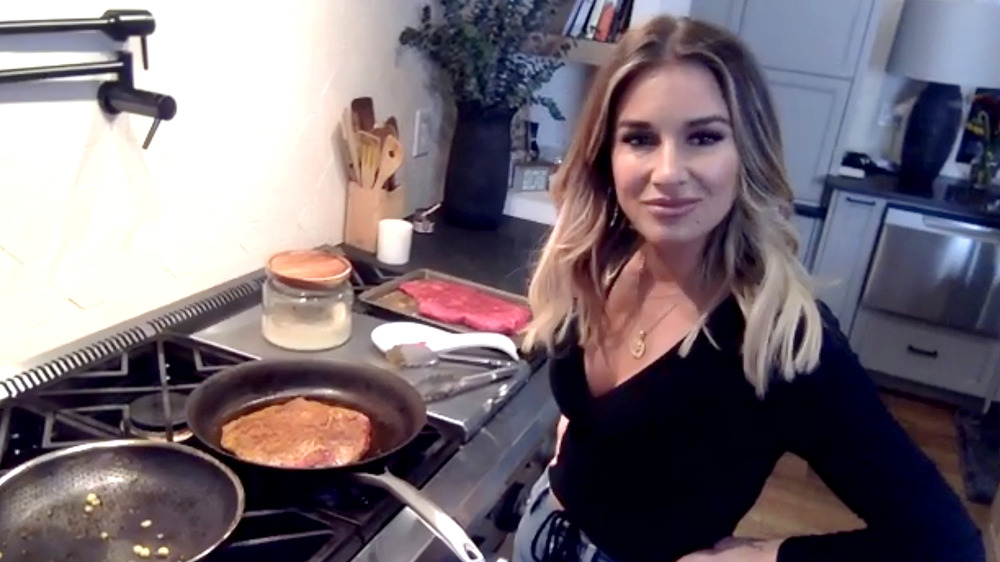 Jessie James Decker cooking in kitchen