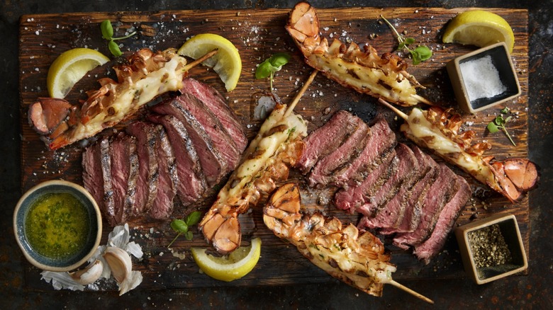 steak and seafood on cutting board