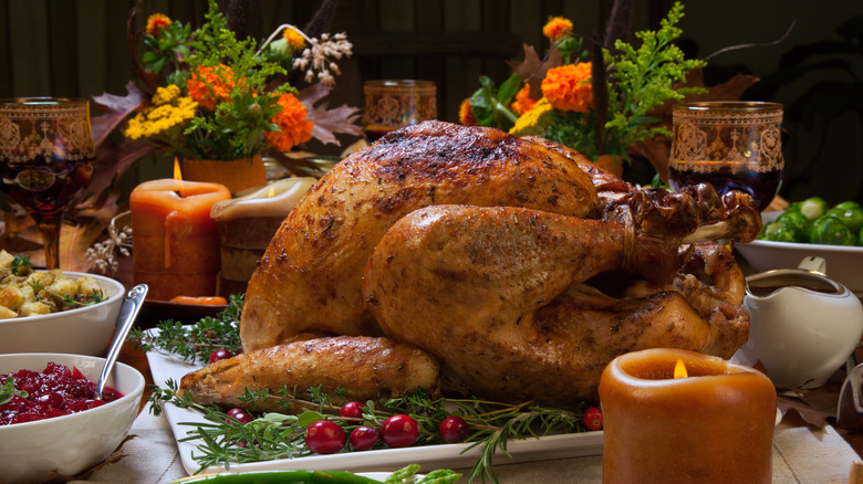 Roast turkey on table with sides