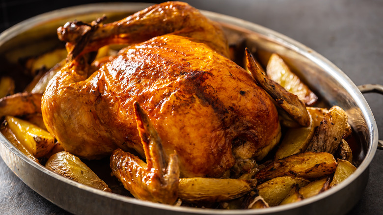 Whole roast chicken with potatoes