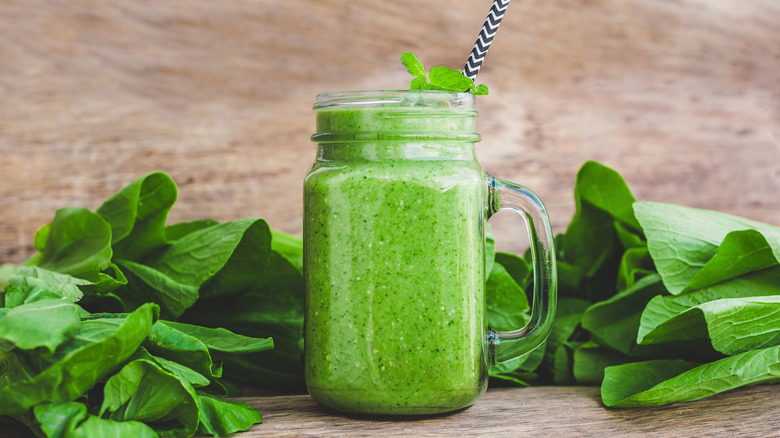 Green smoothie with straw