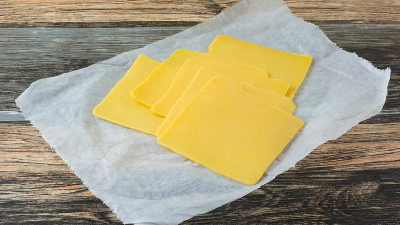 slices of American cheese on wax paper