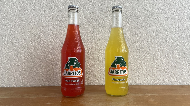 Bottles of fruit punch and pineapple Jarritos