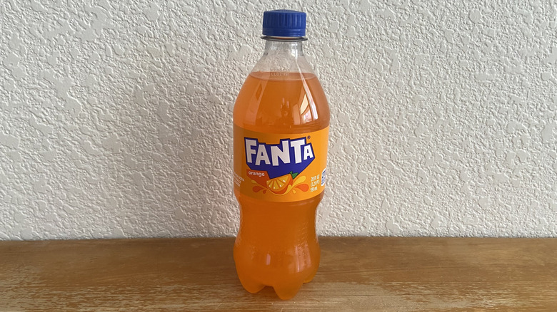 Orange Fanta bottle on table