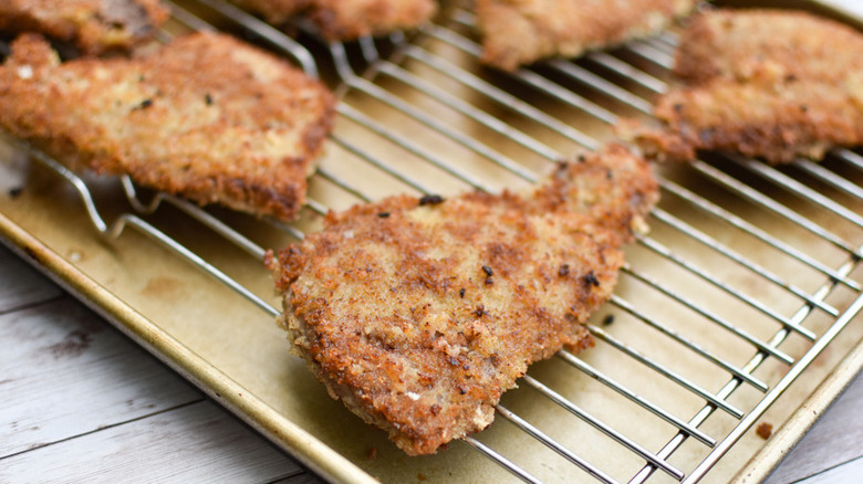 Breaded steak on rack