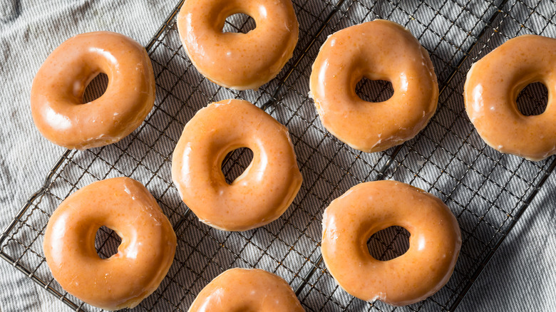 Glazed donuts on wire rack