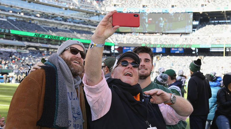 Mario Batali taking photos with fans