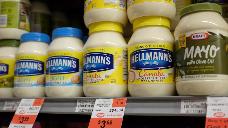 Jars of mayonnaise on grocery store shelf