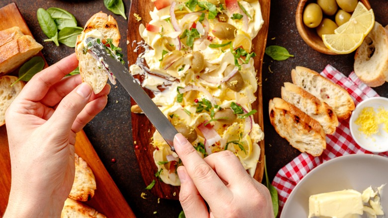 Butter board with olives and onions