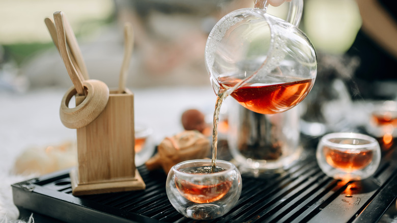 Tea being poured into tea cups