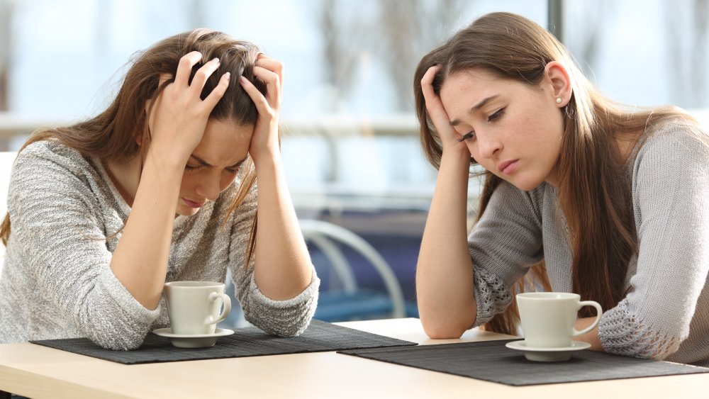 Sad girls drinking coffee