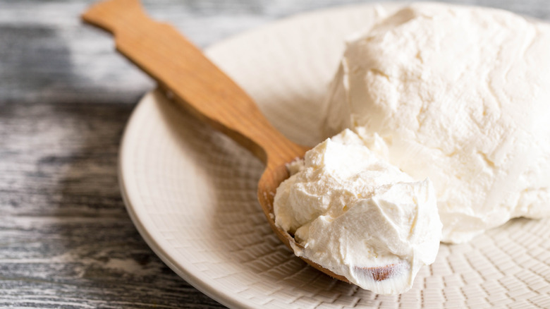 Fresh mascarpone on a white dish 