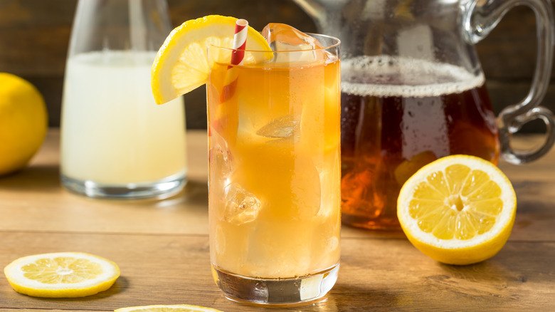 Arnold Palmer in glass with striped straw