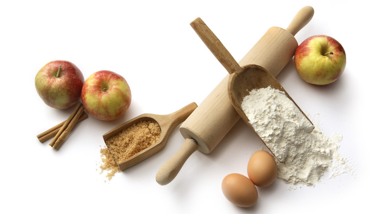 Flour, brown sugar, apples, rolling pin, eggs