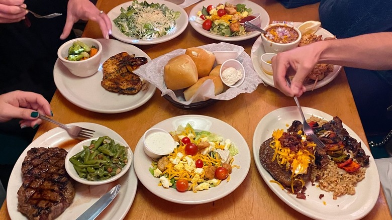 Table full of food at Texas Roadhouse