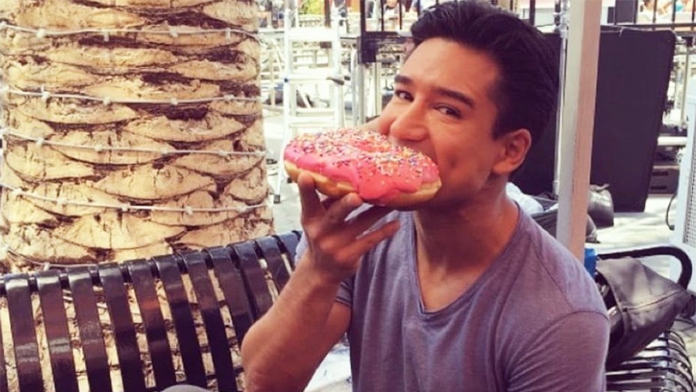 Mario Lopez eating donut