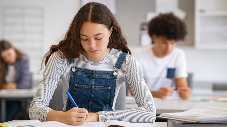 student taking a written test in school