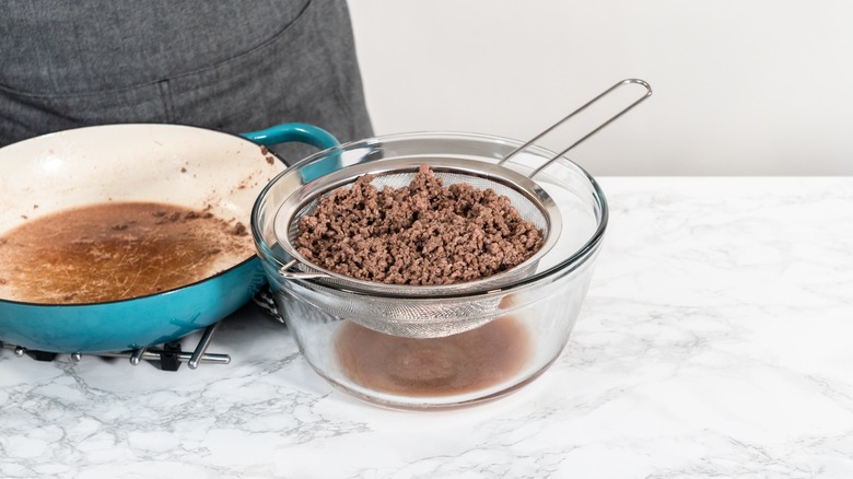 Draining ground beef in colander