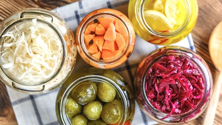 Glass jars of pickled vegetables 