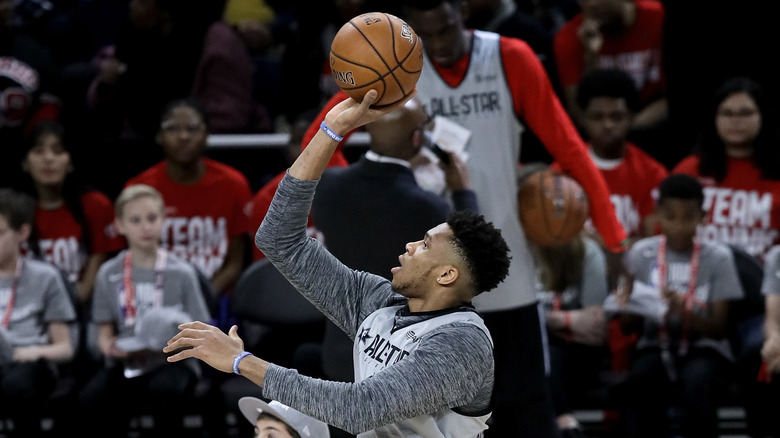 Giannis Antetokounmpo taking a practice shot