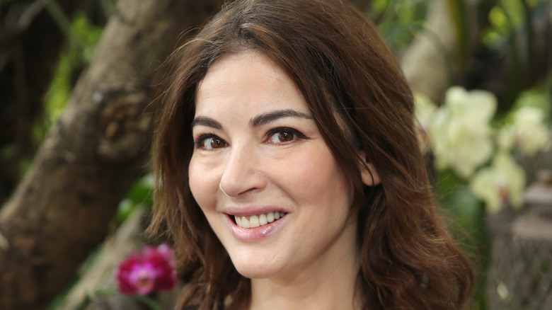 Nigella Lawson smiling outdoors