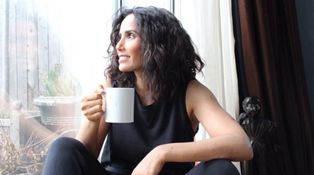 Padma Lakshmi drinking a beverage