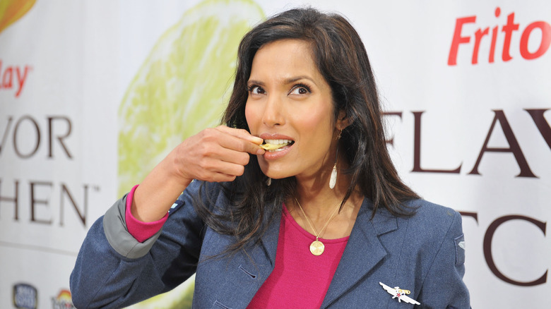 Padma Lakshmi eating a chip