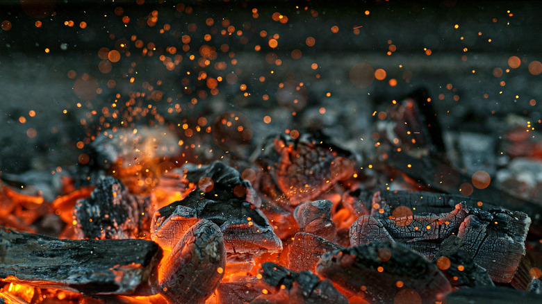 Hot charcoal with embers and sparks