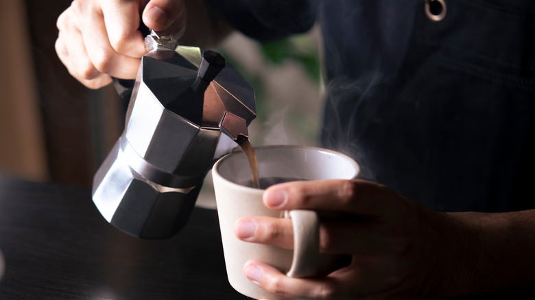 pouring coffee from moka pot