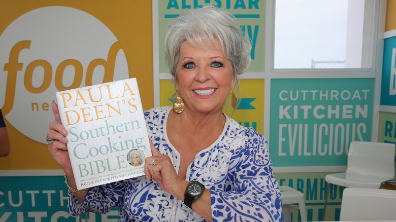 Paula Deen with a cookbook