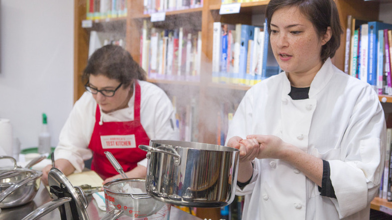 Chef boiling water in a pot