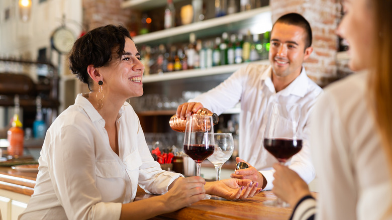 people talking at bar