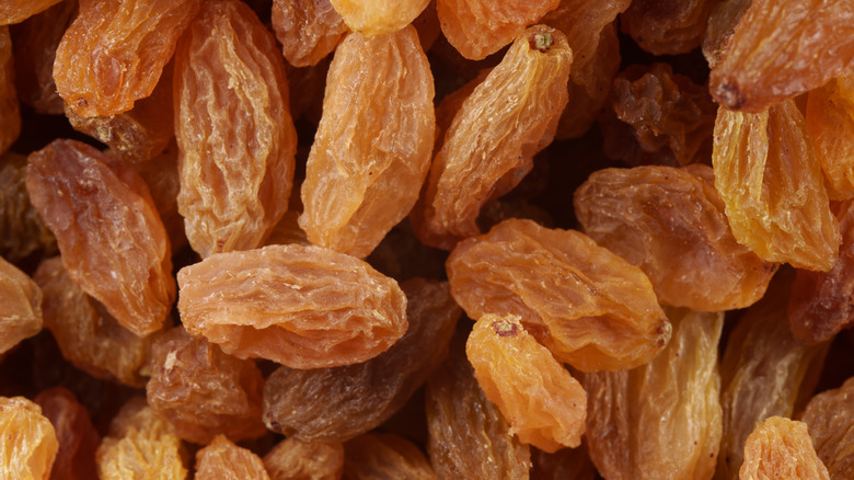 A close-up of golden raisins