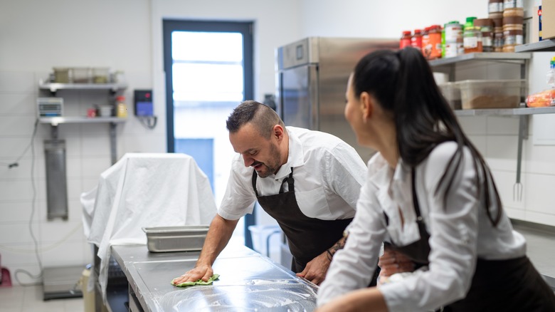 Restaurant staff washing dishes