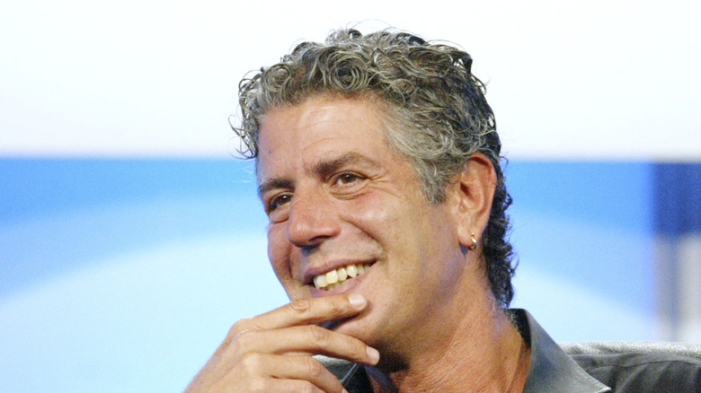 Anthony Bourdain with his hand on his chin