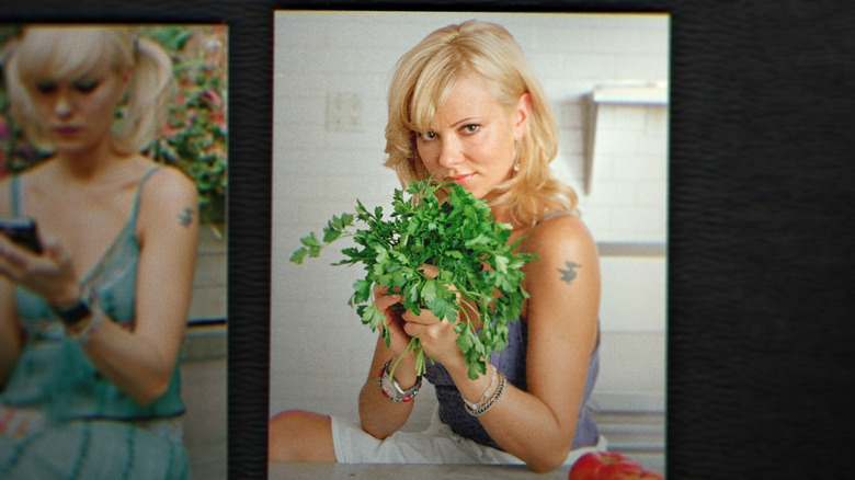 Sarma Melngailis holding cilantro with duck tattoo on shoulder