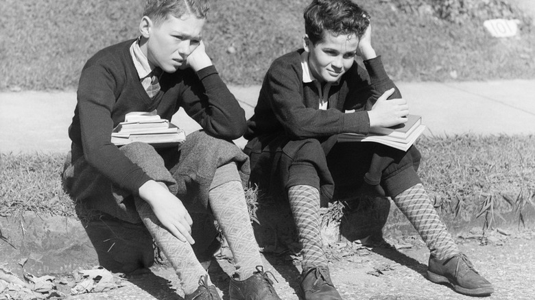 Pair of boys sitting circa 1930s