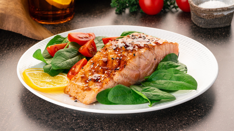 Grilled Salmon on a bed of spinach and tomatoes