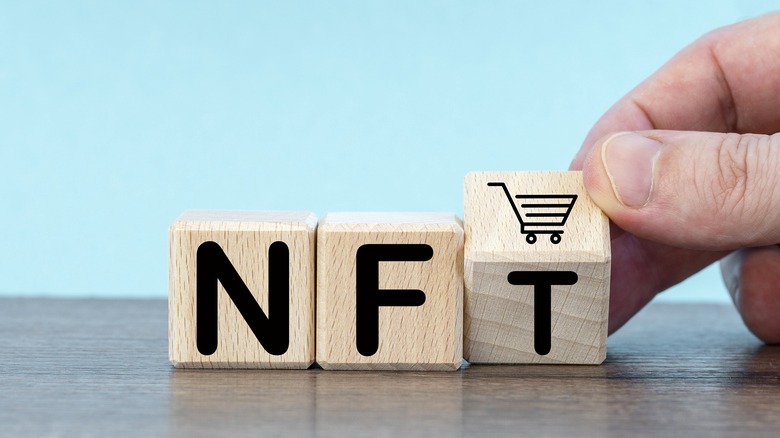 block letters displaying NFT and a shopping cart