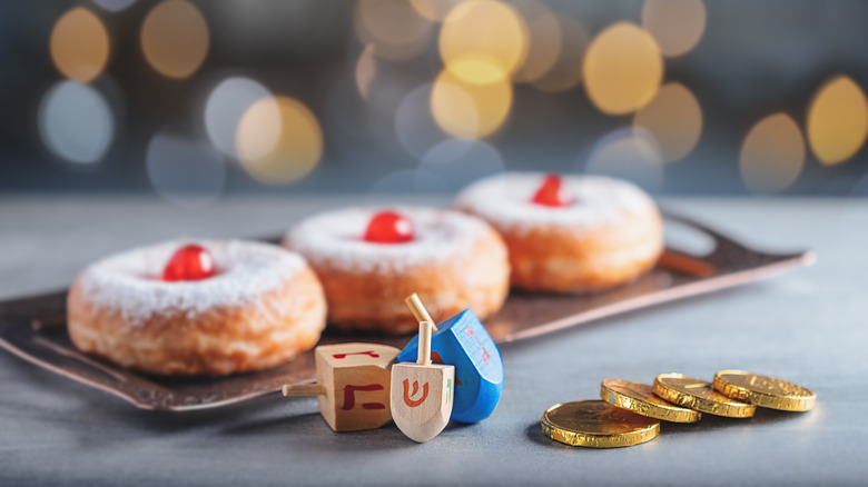 sufganiyot with dreidels and gelt