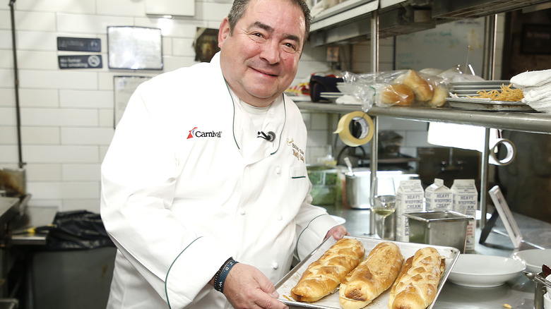 Emeril Lagasse holding bread tray