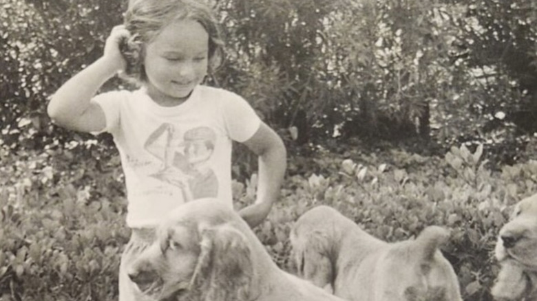 Young Giada De Laurentiis with puppies